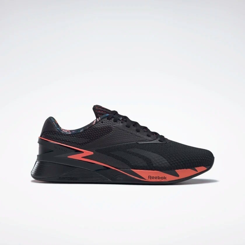 Orange reebok shop shoes
